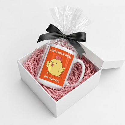 Chick Runs On Coffee mug in a white gift box with pink crinkle paper and a black bow