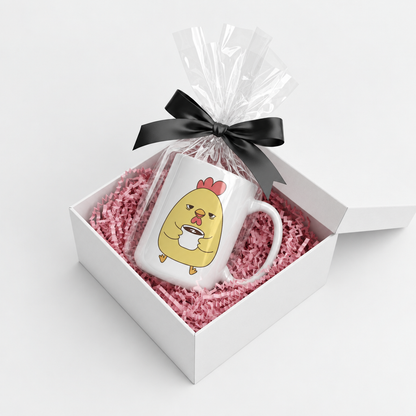 Sleepy Chick mug in a white gift box with pink crinkle paper and a black bow
